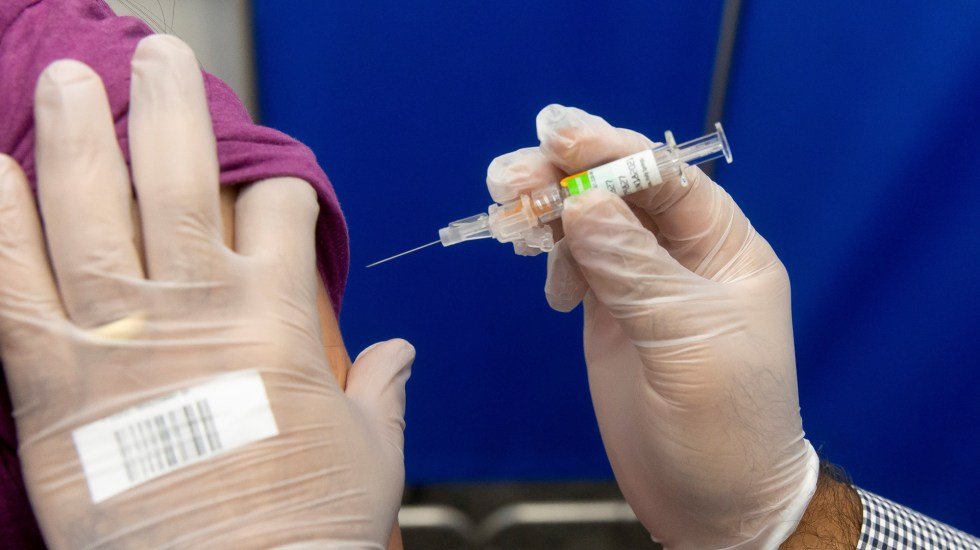 Flu vaccination shots are administrered at a pharmacy in Washington, DC